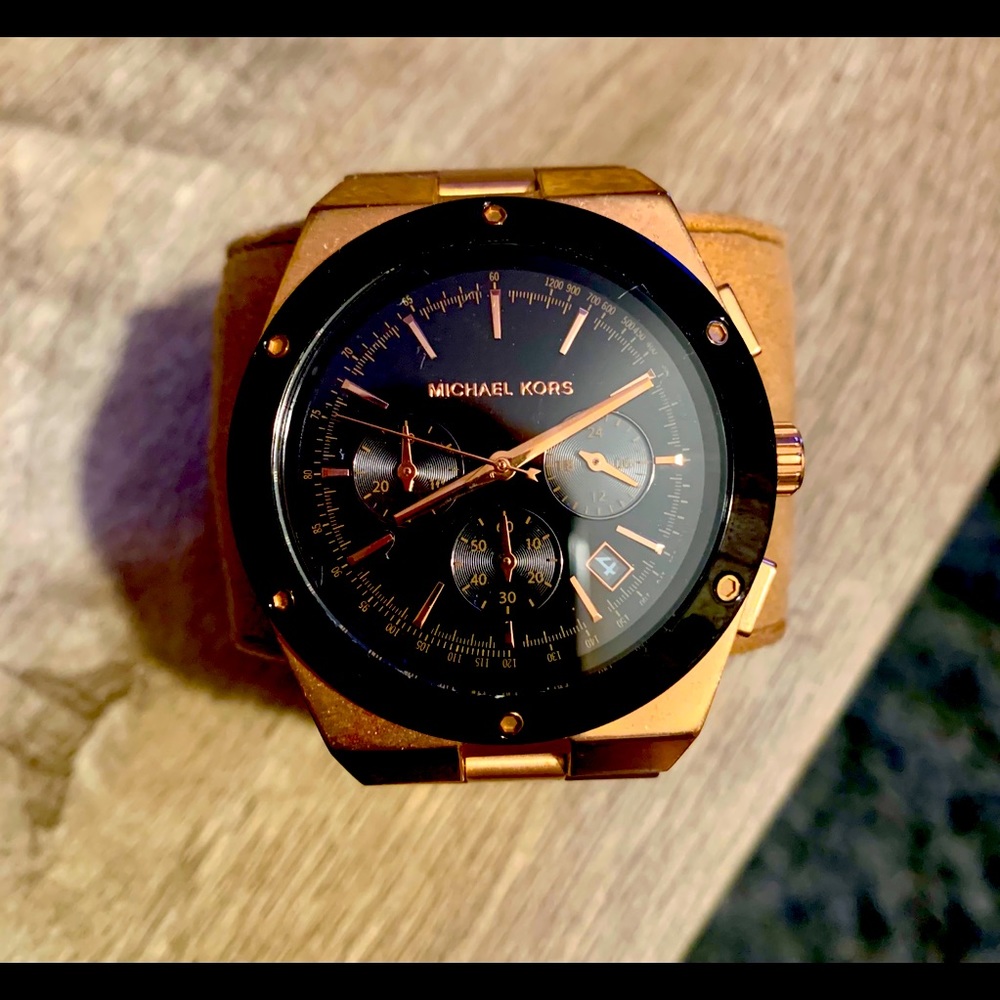 Woman’s Michael Kors rose gold & black watch